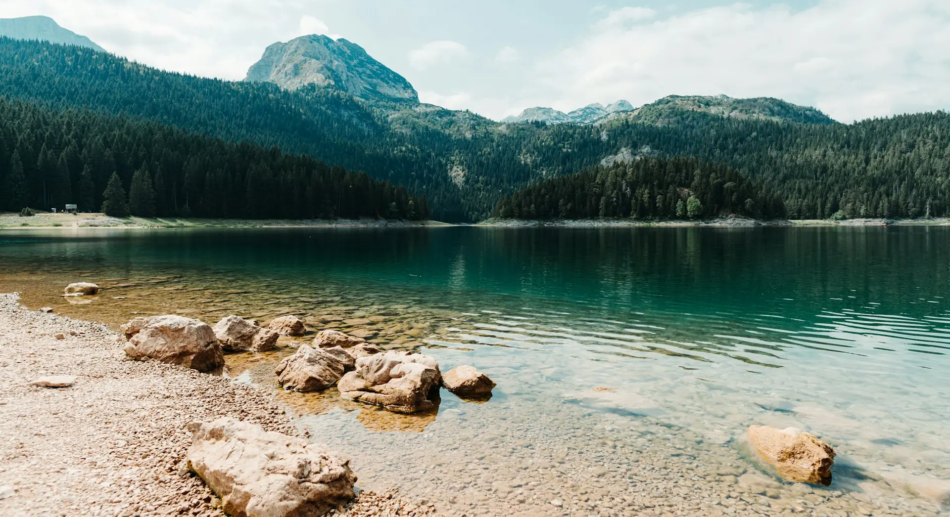View of Žabljak Lake with mountains in the background in Montenegro.